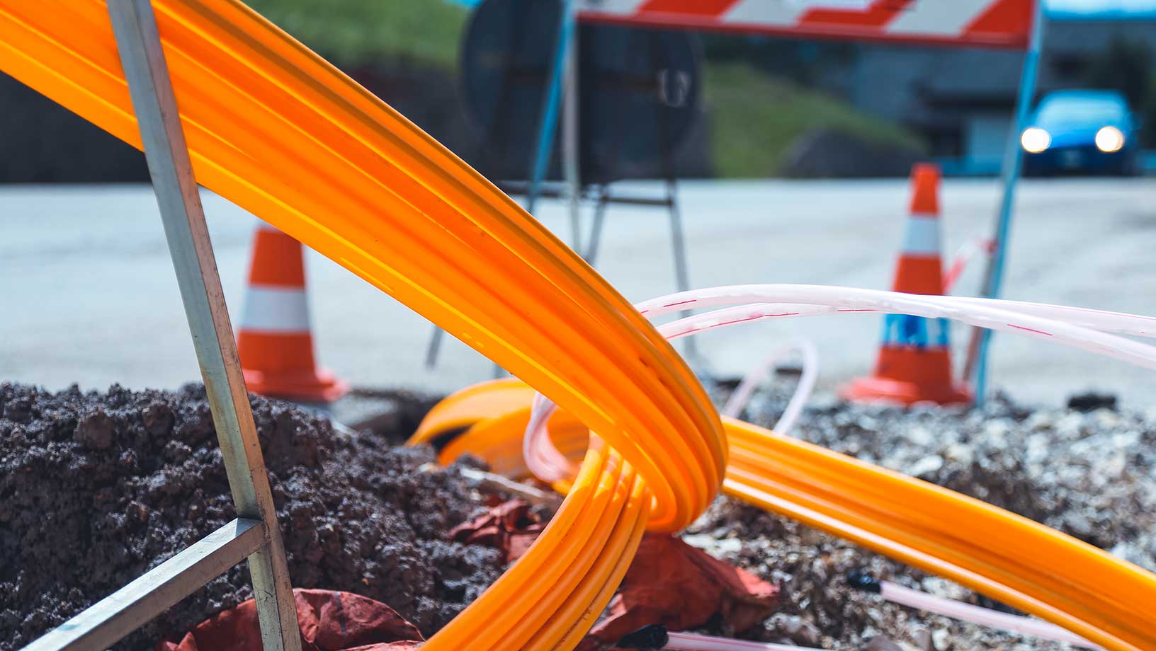 Closeup of construction site with traffic safety cones and underground cabling